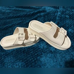 Bone color, country sandals, little bit of platform fits a size 6